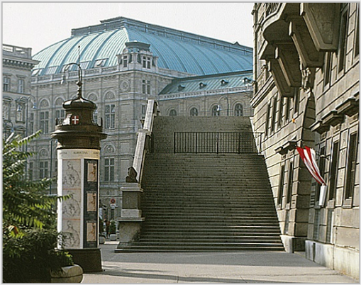 Entrance to the Albertina (right), Vienna. Column with posters announcing the museum's exhibitions "Raphael in der Albertina" and "Stanley Roseman - Zeichnungen aus Klostern," 1983.  Photo by Ronald Davis.